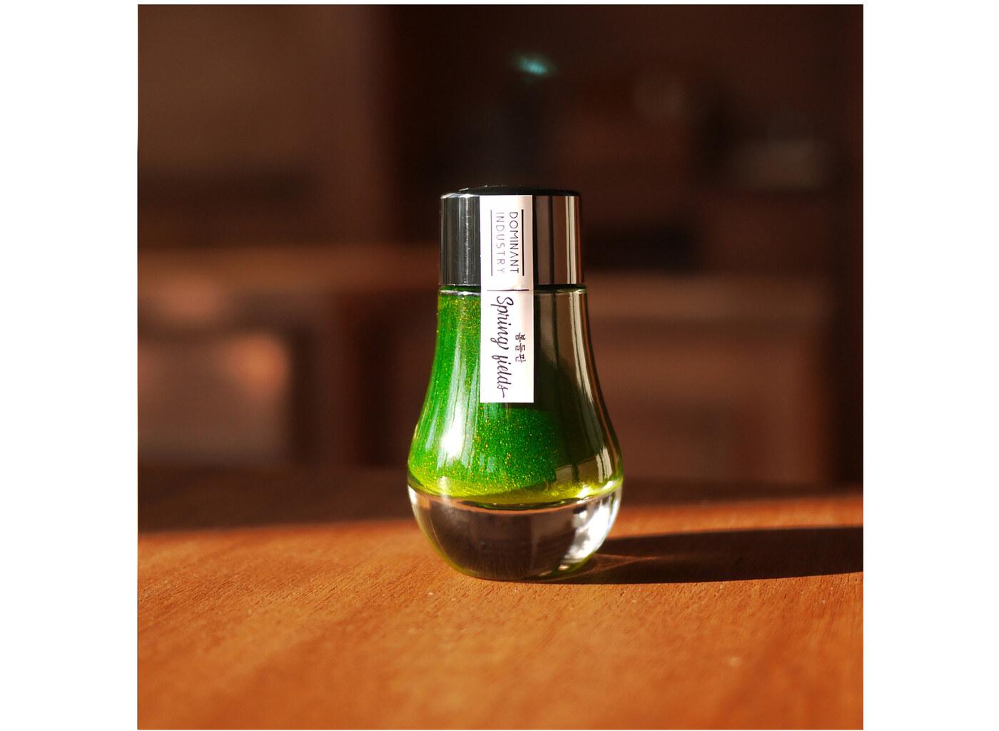 A bottle of Dominant Industry Pearl 016 Spring Fields.