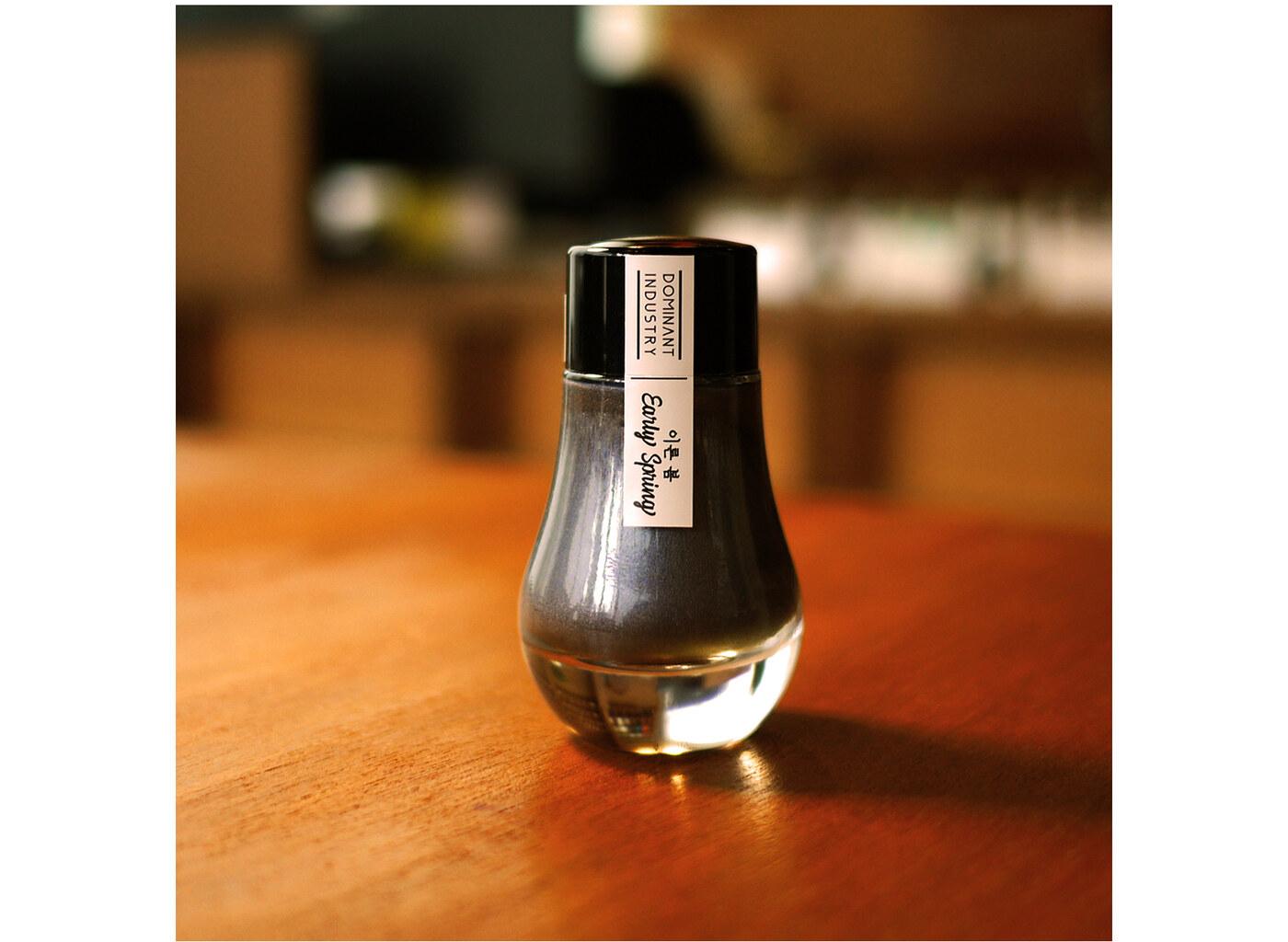A bottle of Dominant Industry Pearl 022 Early Spring.