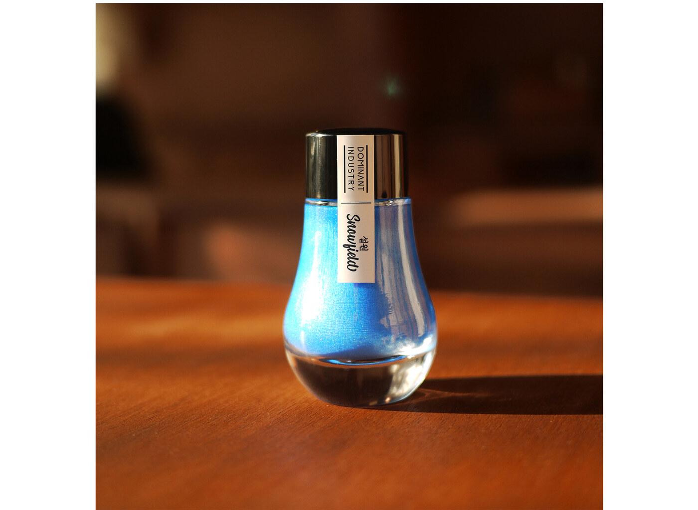 A bottle of Dominant Industry Pearl 021 Snowfield.
