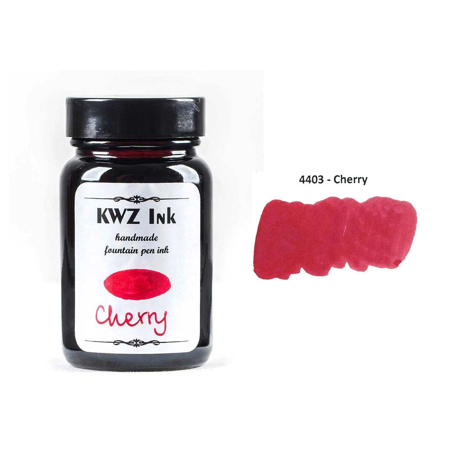 A bottle of KWZ Standard 4403 Cherry beside its swatch.