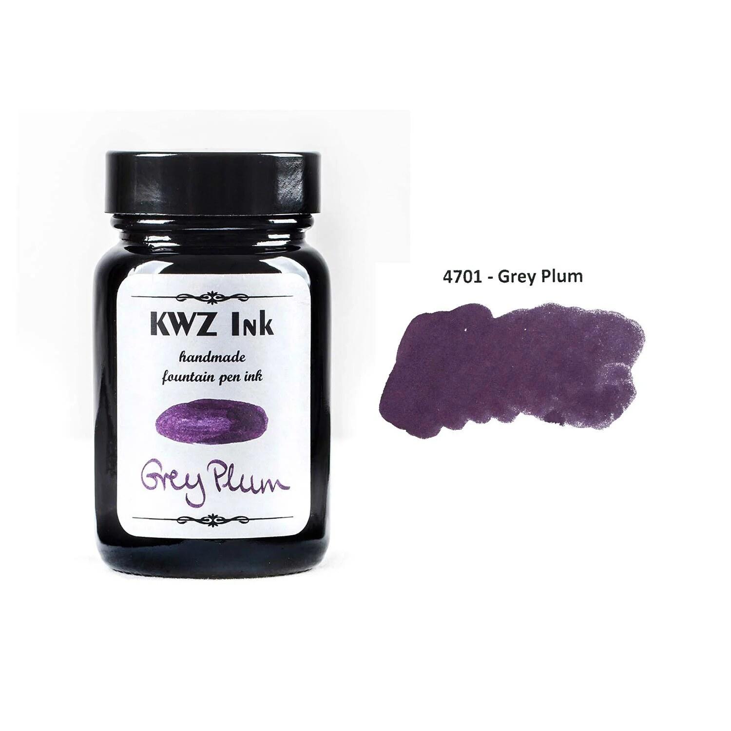 A bottle of KWZ Standard 4701 Grey Plum beside its swatch.