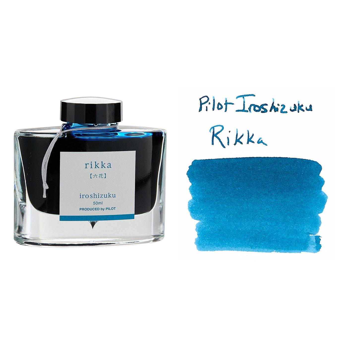 A bottle of Pilot Iroshizuku Rikka beside its swatch.