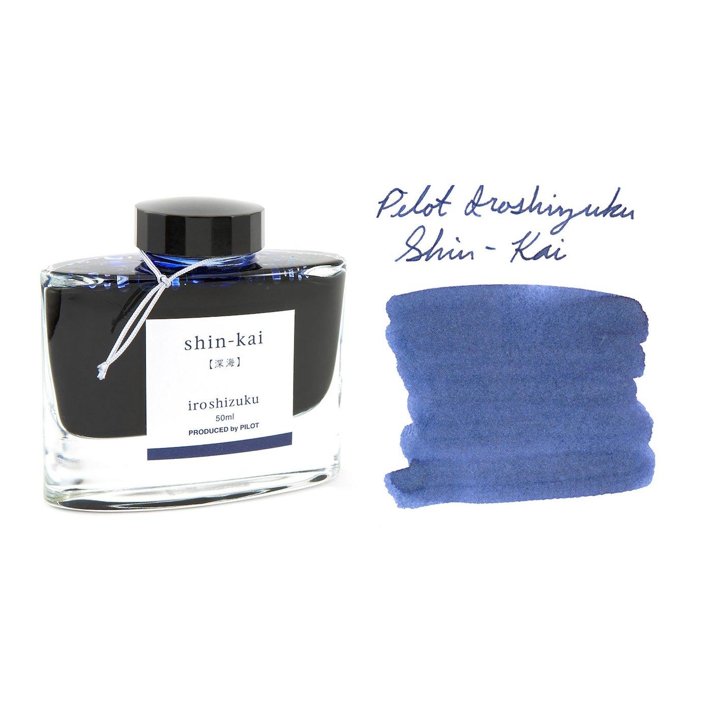 A bottle of Pilot Iroshizuku Shin-kai beside its swatch.
