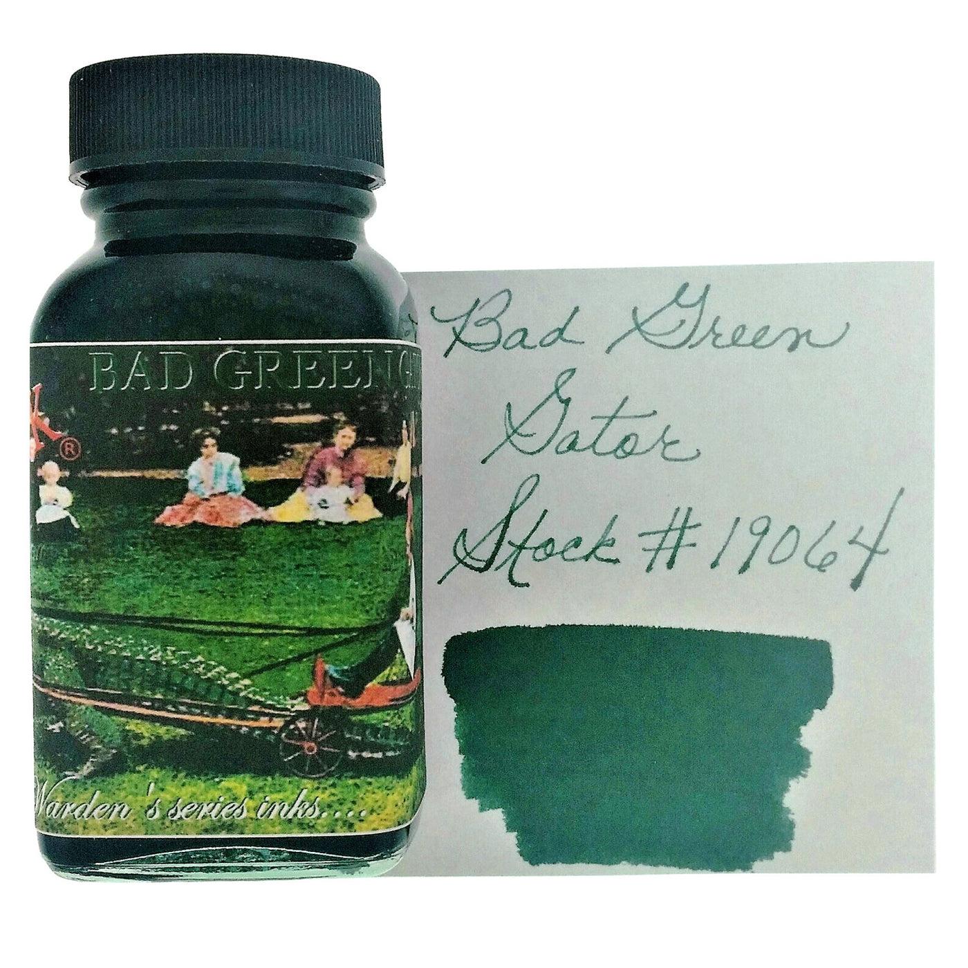 A bottle of Noodler's Bulletproof Bad Green Gator beside its swatch.